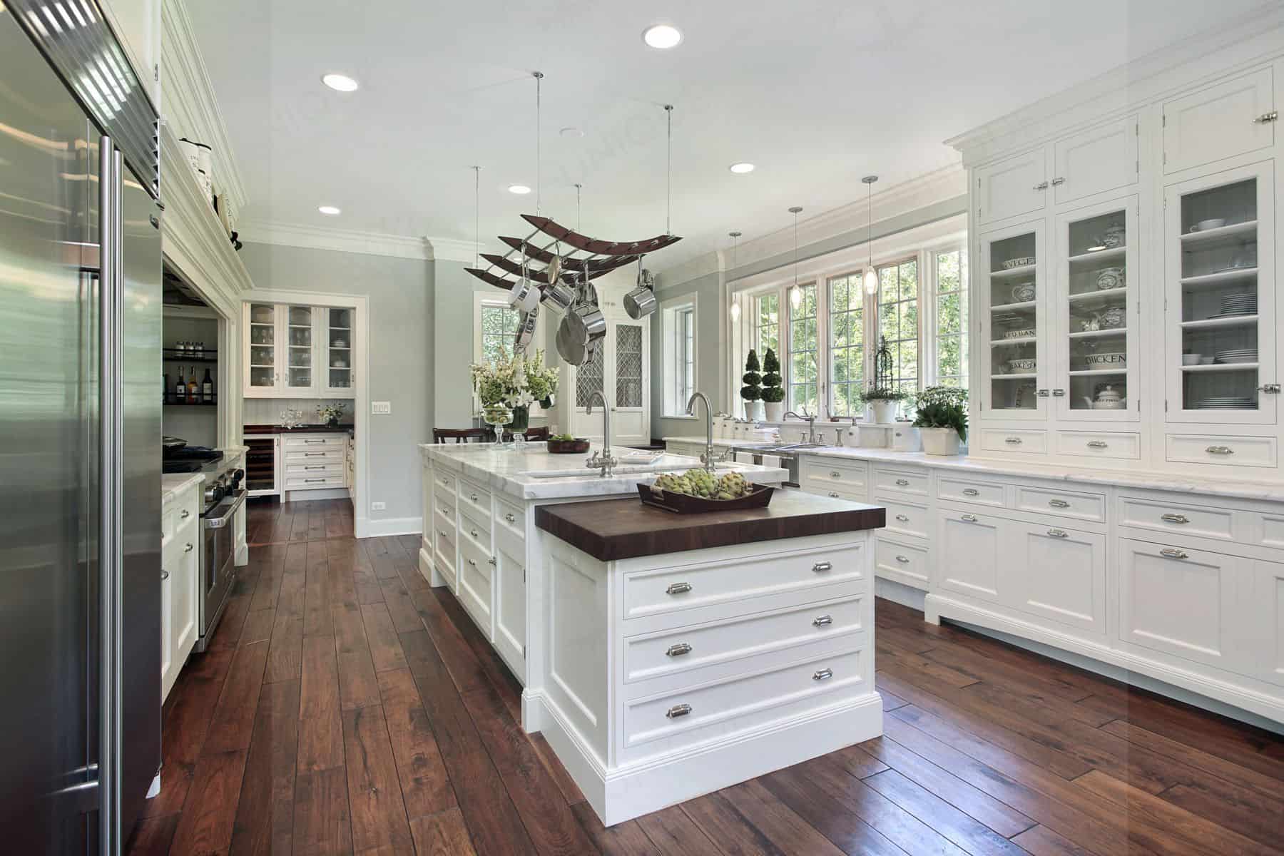 Kitchen in luxury home with white cabinetry